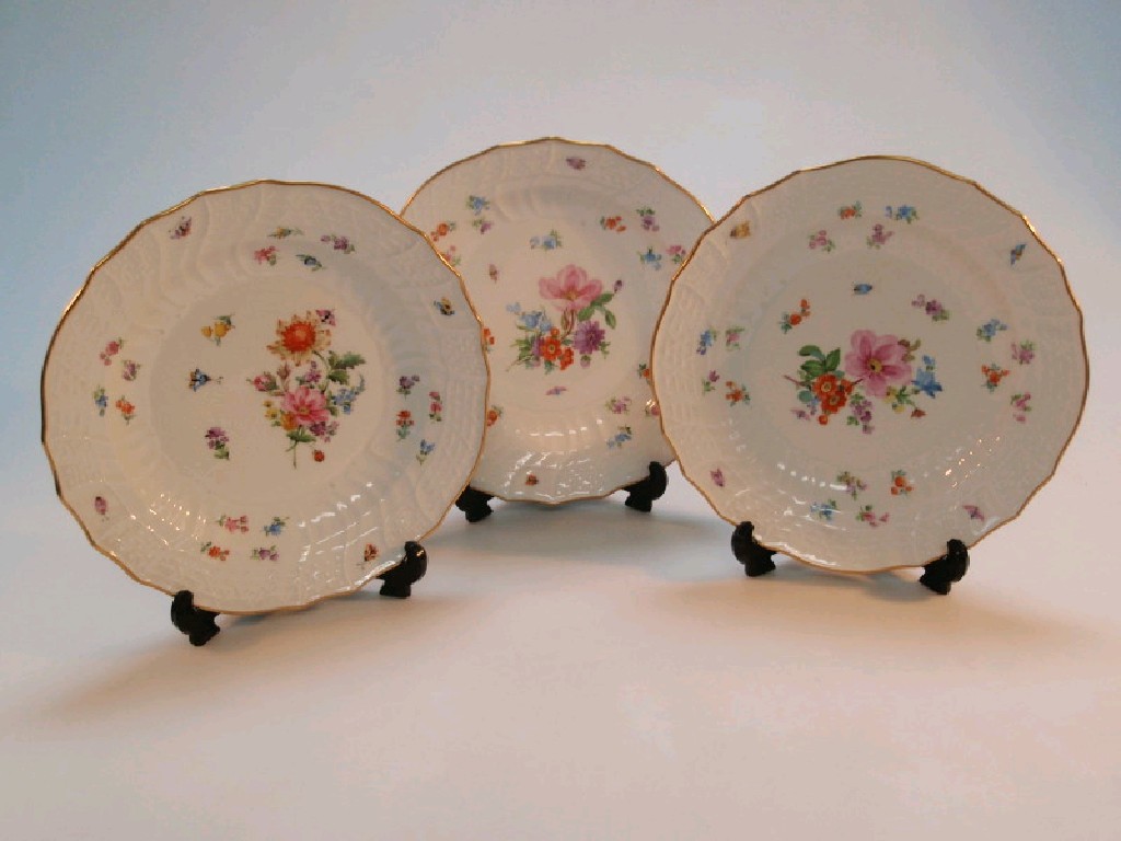 Appraisal: Three Meissen dessert plates each painted with Deutsche Blumen within