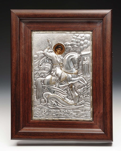 Appraisal: A modern Greek framed iconin white metal with embossed and