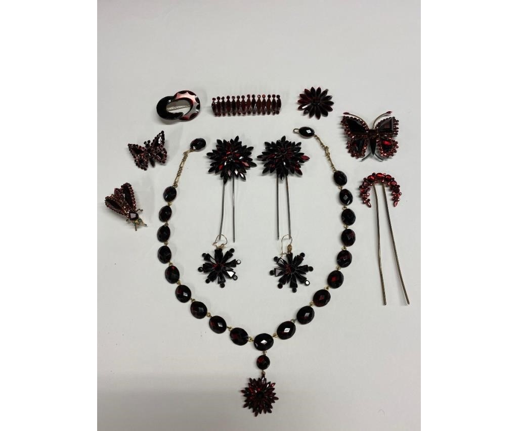 Appraisal: English red Vauxhall glass collection to include a necklace l