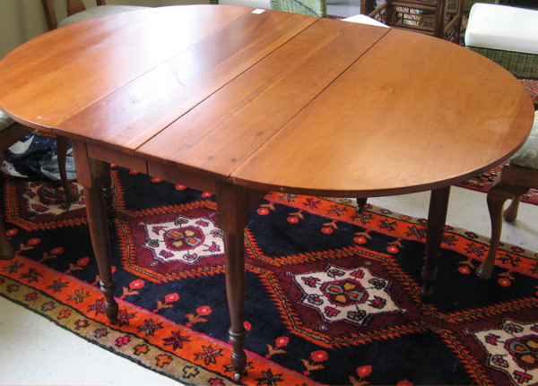 Appraisal: VICTORIAN DROP-LEAF CHERRYWOOD DINING TABLE American late th century having