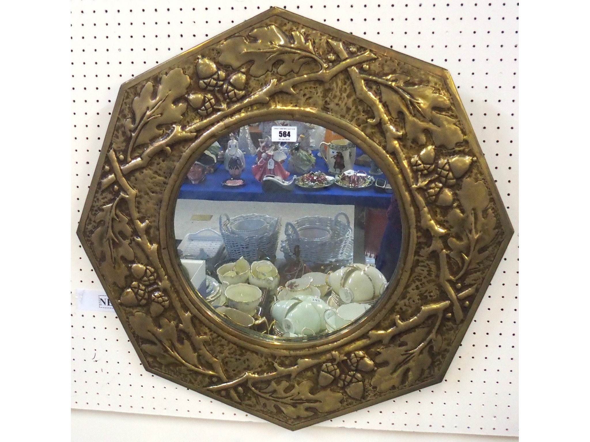 Appraisal: An Arts and Crafts style mirror the octagonal shaped frame