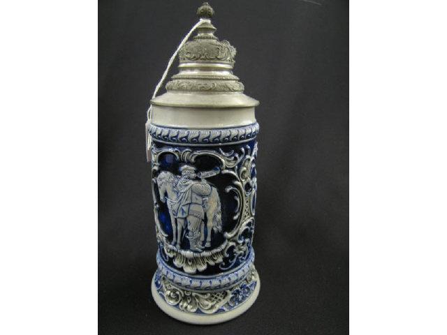 Appraisal: German Pottery Stein cobalt on grey salt glaze bas-relief scenes