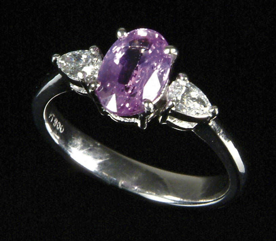 Appraisal: PINK SAPPHIRE DIAMOND AND PLATINUM LADY S RING Center oval