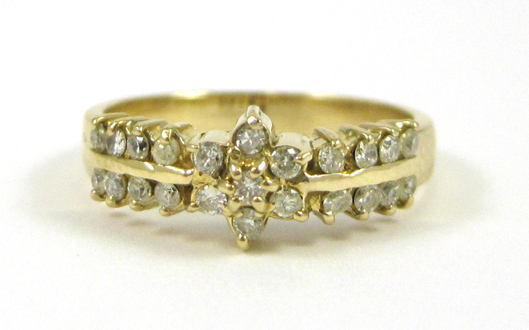 Appraisal: DIAMOND AND FOURTEEN KARAT GOLD RING set with round-cut diamonds