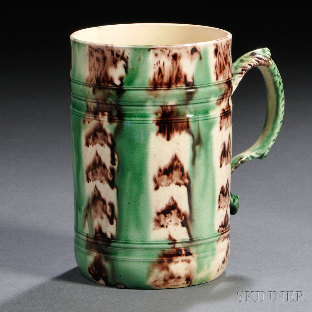 Appraisal: Staffordshire Cream-colored Earthenware Tankard England c cylindrical with foliate molded