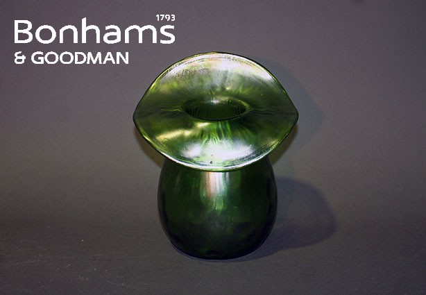 Appraisal: A Loetz style green glass vase with large overhanging lip