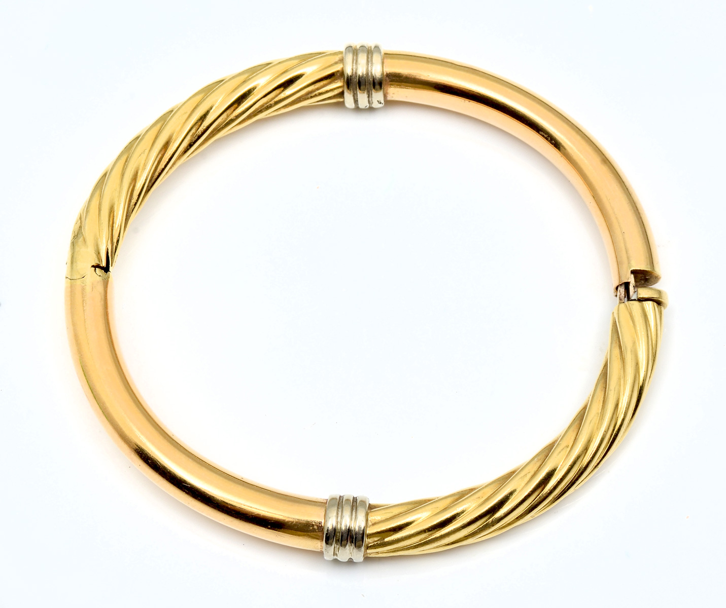 Appraisal: K GOLD SPIRAL TWIST BANGLE G K yellow gold bangle