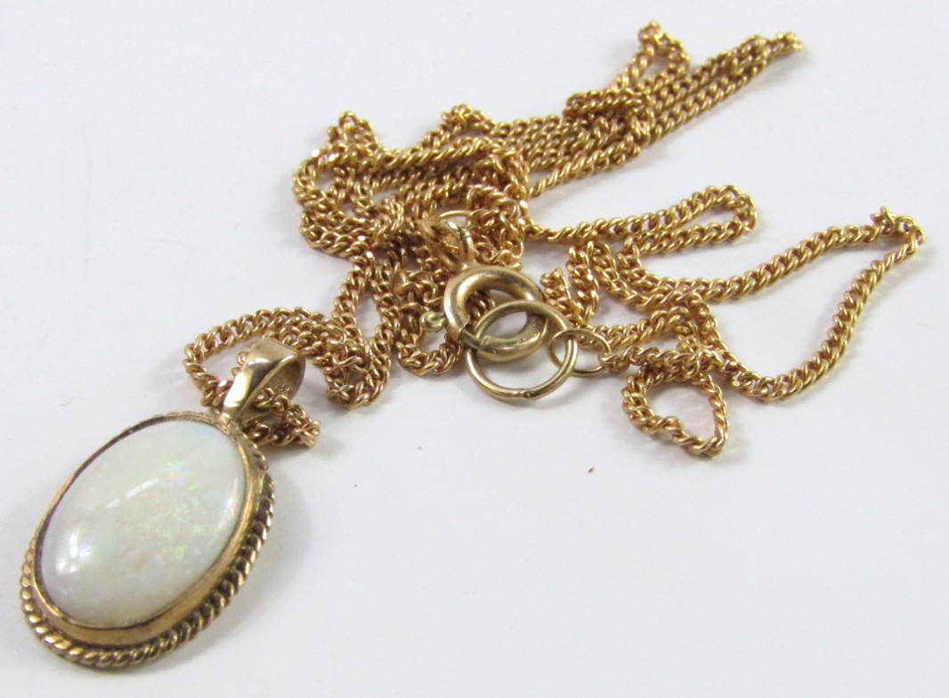 Appraisal: A ct gold set opal pendant with ct gold thin