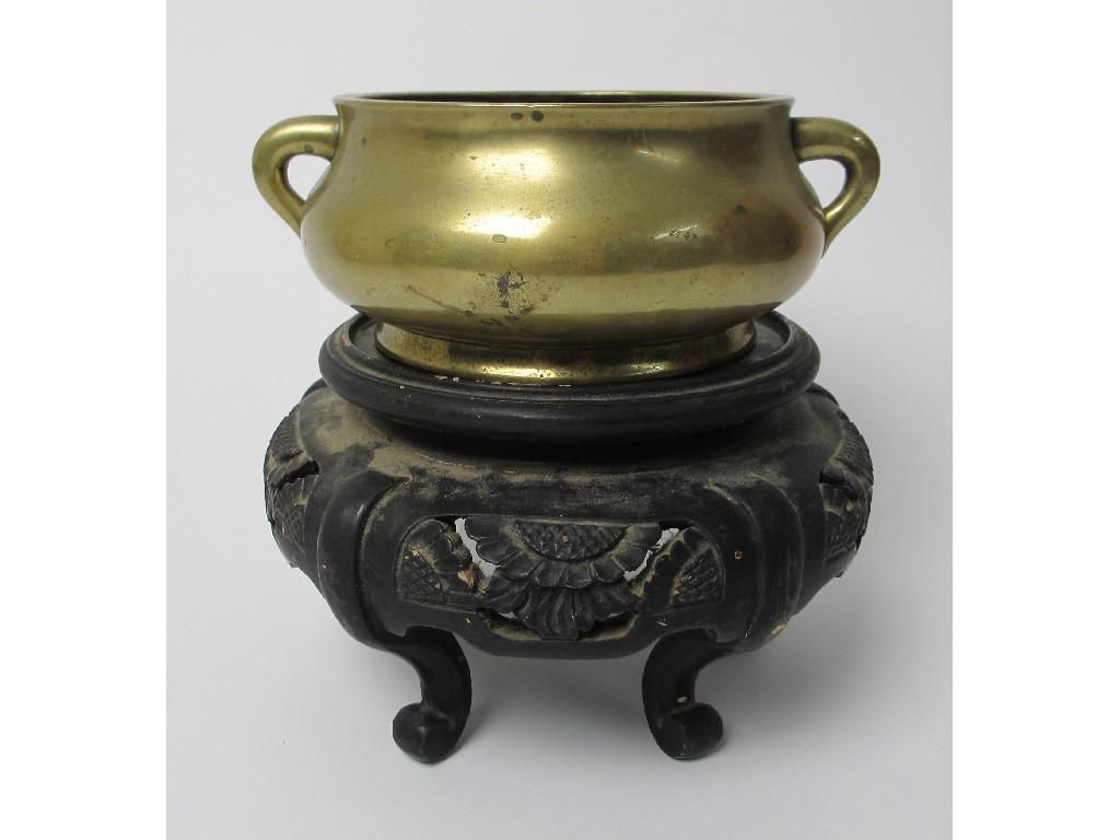 Appraisal: A Chinese bronze incense burner of baluster form with twin