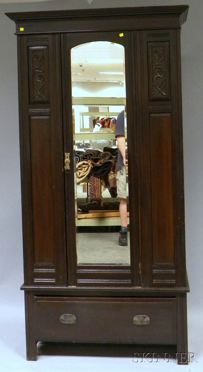 Appraisal: Late Victorian Walnut-finished Carved Wood and Mirrored Armoire with Long