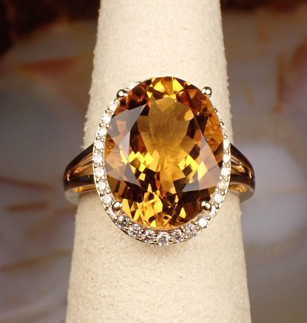 Appraisal: CITRINE DIAMOND AND FOURTEEN KARAT GOLD RING The yellow gold