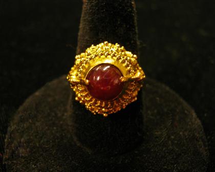 Appraisal: karat yellow gold and amethyst ringOrnate gold mounting displaying round