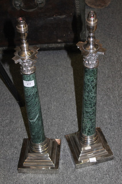 Appraisal: A PAIR OF PLATED STANDARD LAMPS with green marble Corinthian