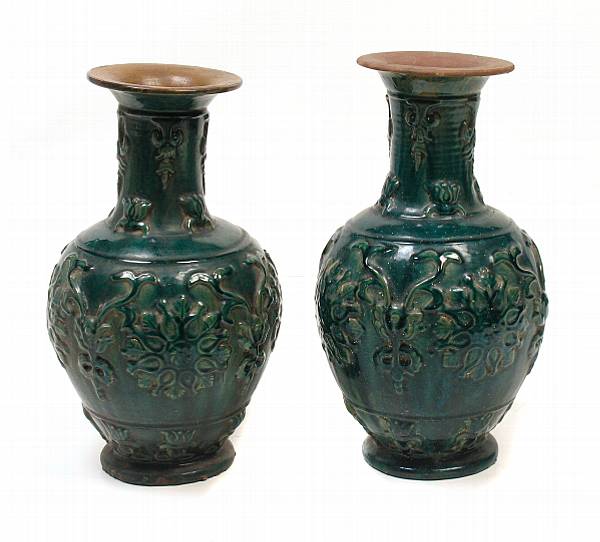 Appraisal: A pair of Chinese green glazed earthenware jars height in