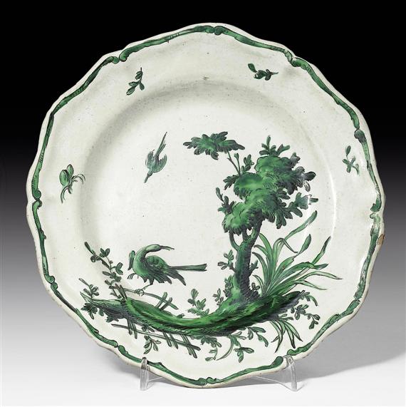 Appraisal: PAIR OF SMALL FAIENCE PLATES WITH COPPER GREEN DECORATION FAENZA