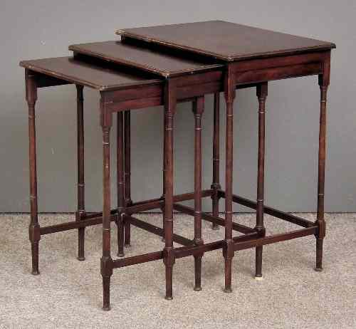 Appraisal: A nest of three Edwardian mahogany occasional tables on slender