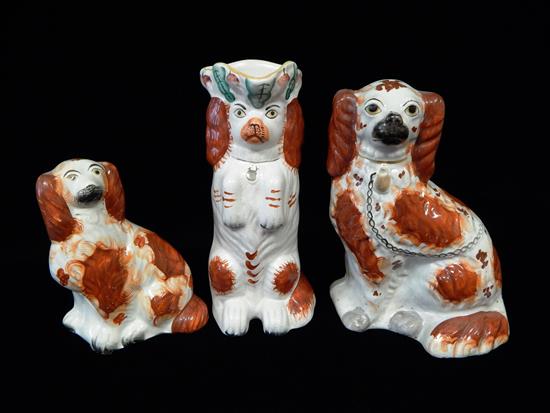 Appraisal: Mid- th C English Staffordshire white and auburn spaniels three