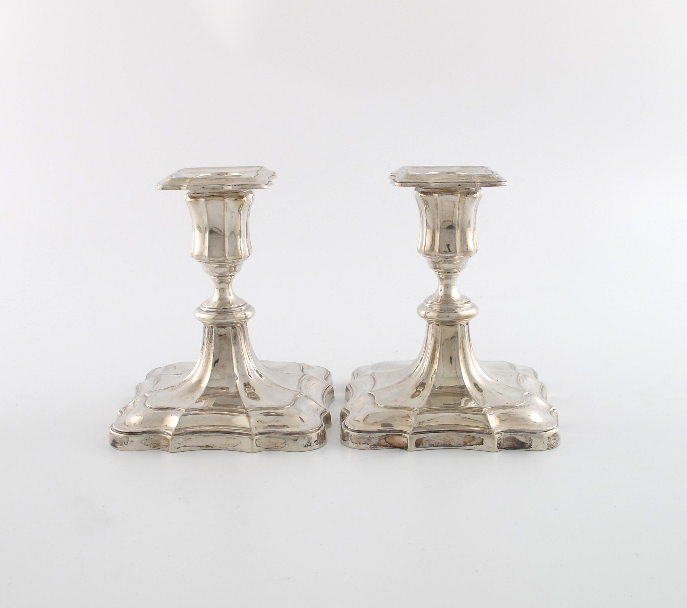 Appraisal: A pair of Edwardian dwarf silver candlesticks