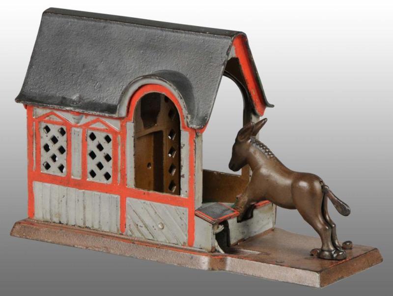 Appraisal: Cast Iron Mule Entering Barn Mechanical Bank Description Manufactured by