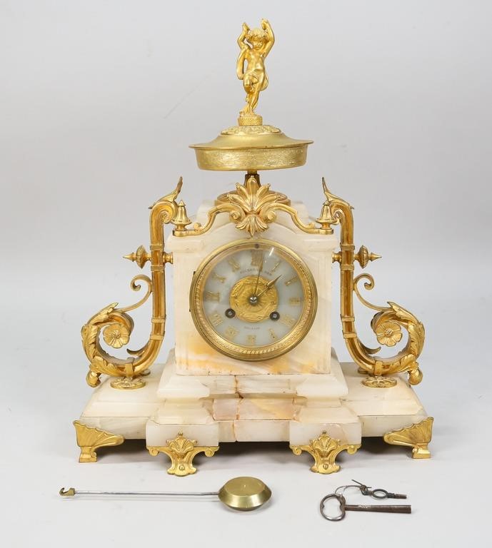 Appraisal: Gilbert Son Belfast alabaster and gilt metal mantle clock French