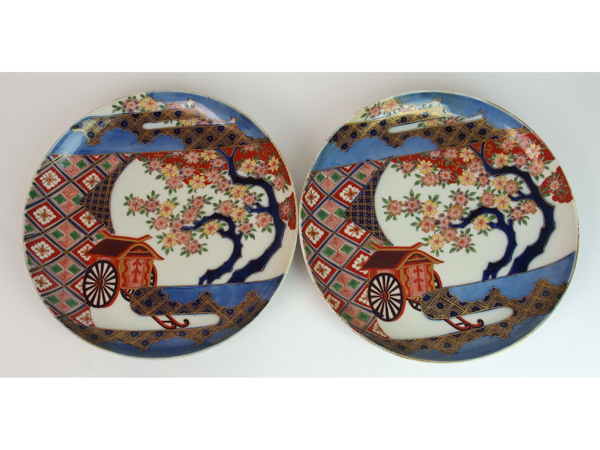 Appraisal: A pair of Nabeshima style circular disheseach painted with carriages