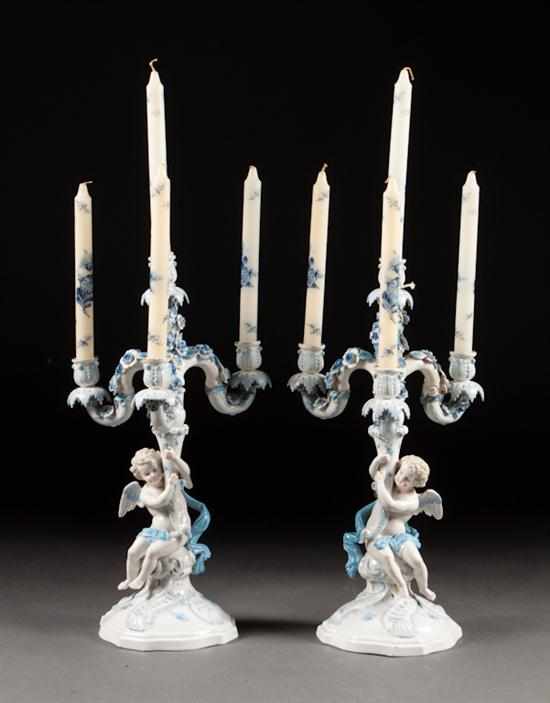 Appraisal: Pair of Sitzendorf painted porcelain figural four-light candelabra early th