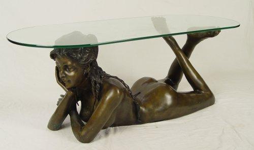 Appraisal: BRONZE NUDE FIGURAL COCKTAIL TABLE Glass top over bronze figure