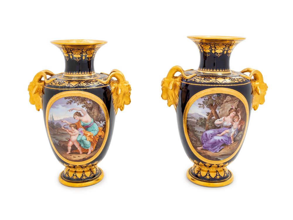 Appraisal: A Pair of Vienna Painted and Parcel Gilt Handled Porcelain