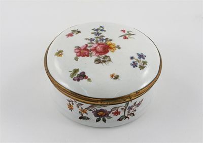 Appraisal: A large Bilston enamel circular box with metal-mounted hinged cover