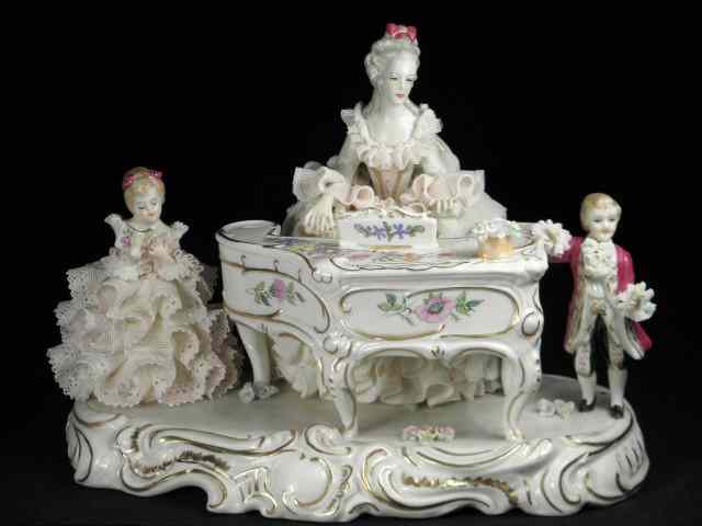 Appraisal: Irish Dresden lace porcelain figural group Titled on base ''Music