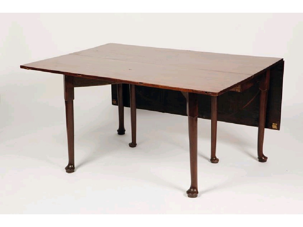 Appraisal: A GEORGE III MAHOGANY DINING TABLE comprising a central drop