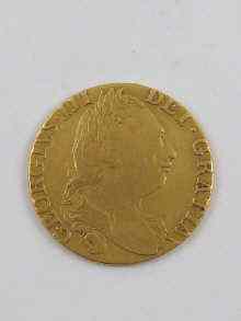 Appraisal: A gold George III guinea coin dated grams