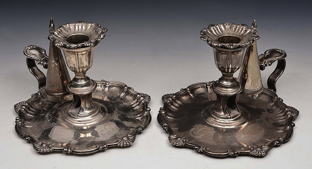 Appraisal: A PAIR OF VICTORIAN SILVER CHAMBER STICKS AND SNUFFERS with