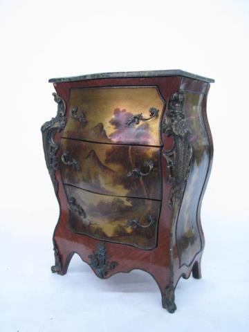 Appraisal: A French Bombe style three-drawer commode with decorative cast metal