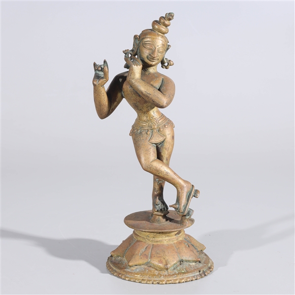 Appraisal: Indian bronze statue of Krishna playing the flute atop integral