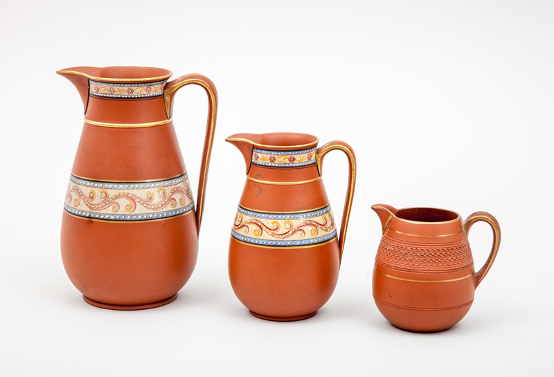 Appraisal: F R PRATT CO PRATTWARE THREE JUGS Transfer-print decorated terracotta