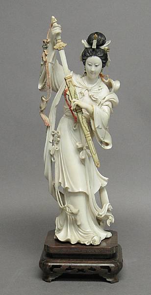 Appraisal: A polychromed ivory female figure th Century Attached to a