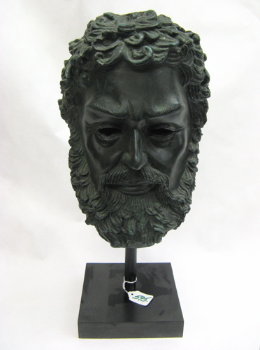 Appraisal: A BRONZE HEAD OF ZEUS green patination height in raised