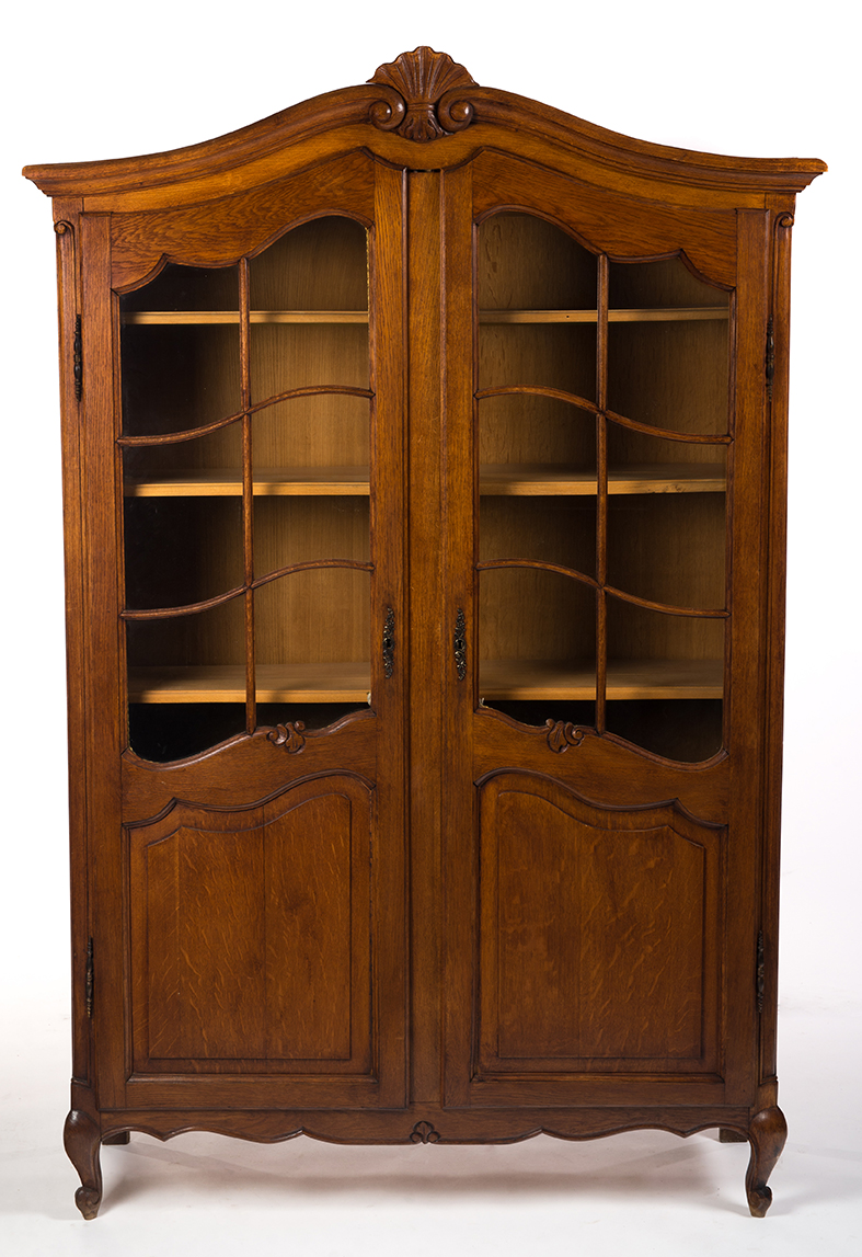 Appraisal: TWO-DOOR BELGIUM-STYLE LIBRARY CASE European th century oak Arched cornice