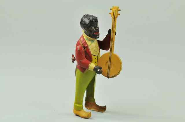 Appraisal: MINSTREL WITH BANJO Attributed to Gunthermann Germany hand painted tin