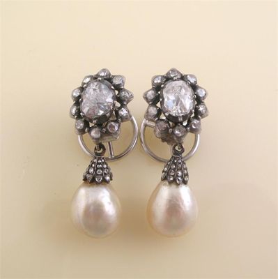 Appraisal: A pair of diamond and pearl drop earrings The oval