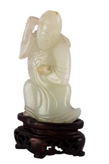 Appraisal: A CHINESE PALE CELADON JADE FIGURE OF A SAGE QING