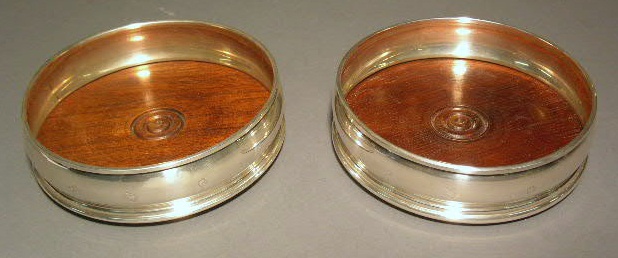 Appraisal: Pair of sterling silver wine coasters