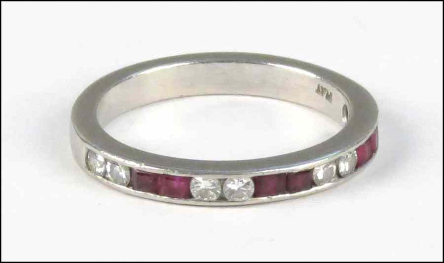 Appraisal: PLATINUM DIAMOND AND RUBY BAND Comprised of six channel cut