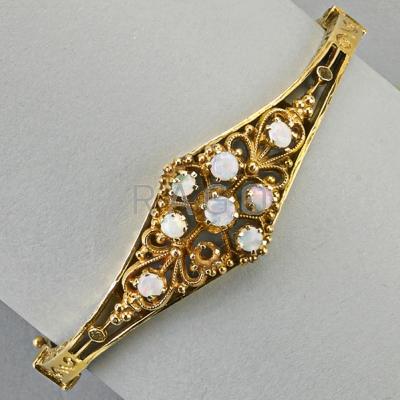 Appraisal: VICTORIAN REVIVAL K GOLD OPAL HINGED BRACELET Unmarked dwt x