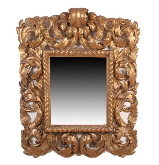 Appraisal: ITALIAN ROCOCO-STYLE LEAF CARVED MIRROR th century red bole water