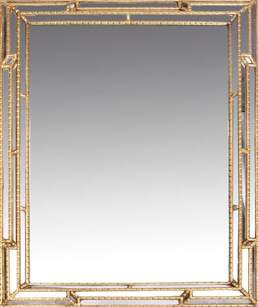 Appraisal: A Continental gilt and glazed mirror height in width in