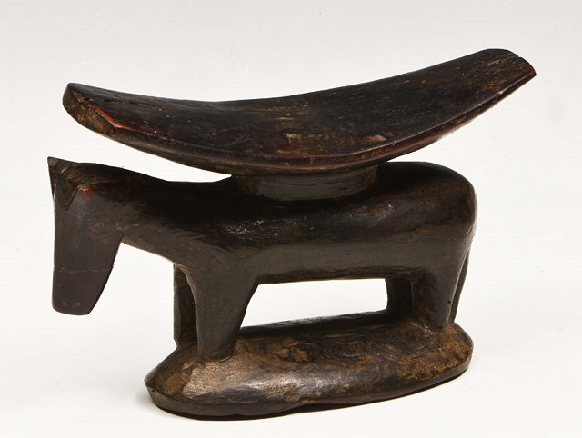 Appraisal: A SOUTH AFRICAN CARVED WOODEN HEAD REST in the form