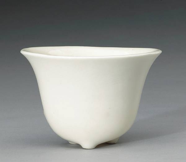 Appraisal: A Dehua porcelain footed cup th Century Of oval section