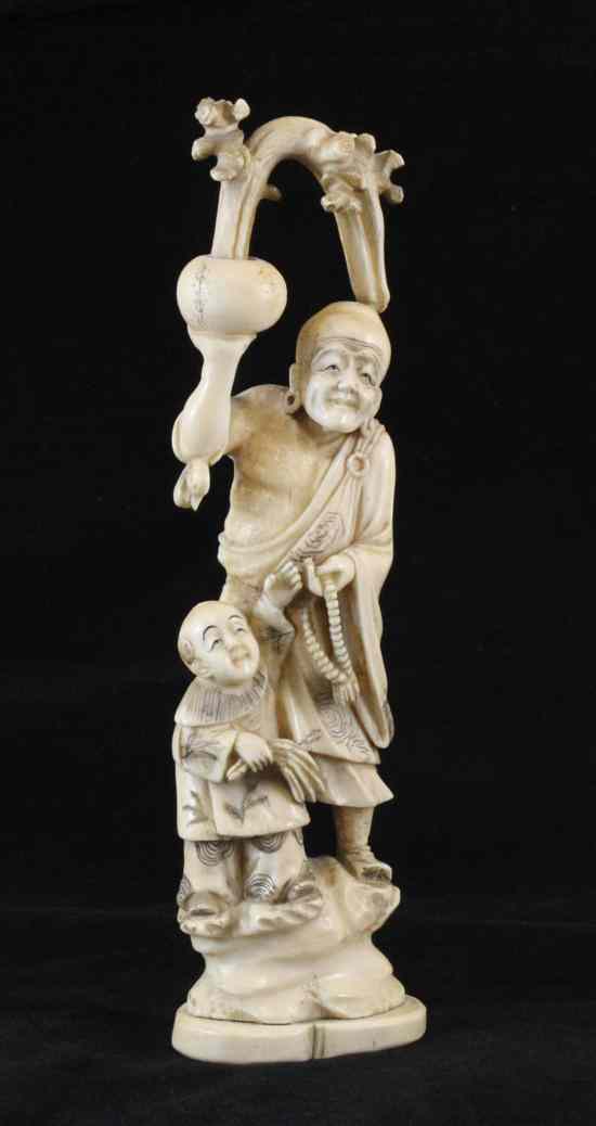 Appraisal: A Japanese ivory group early th century carved as a